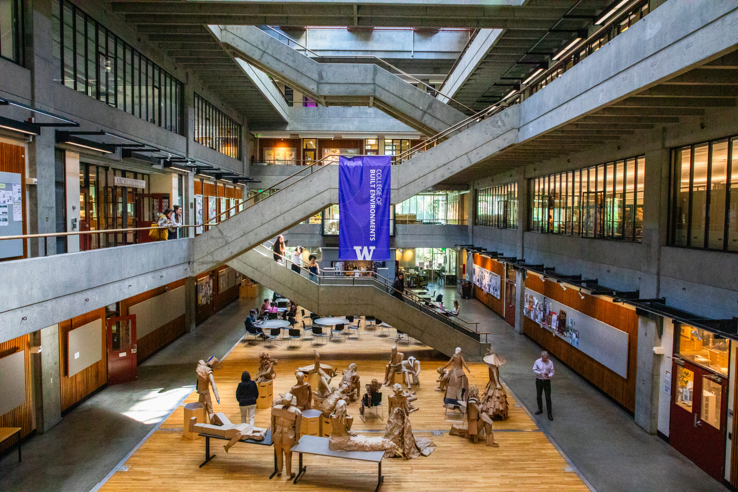 Sunlit court filled with cardboard figures