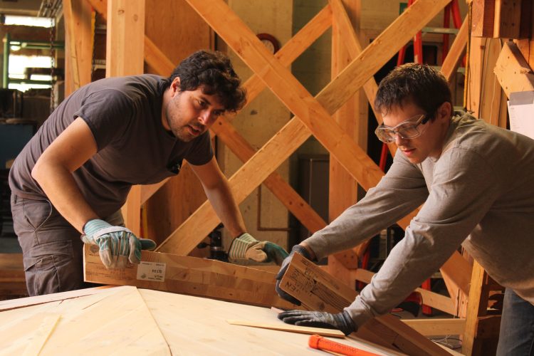 Tomas and Nathan working on mass timber layout